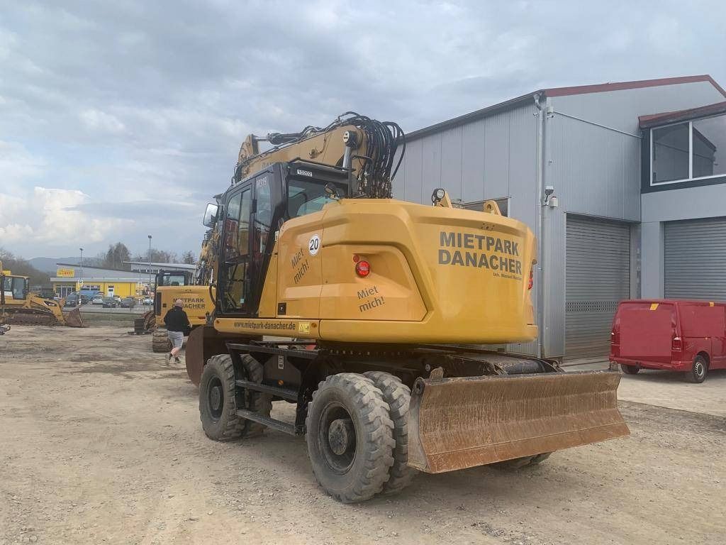 2022 Caterpillar M319-07B wheel excavator rear three-quarter view 2022 Caterpillar M319-07B wheel excavator rear three-quarter view