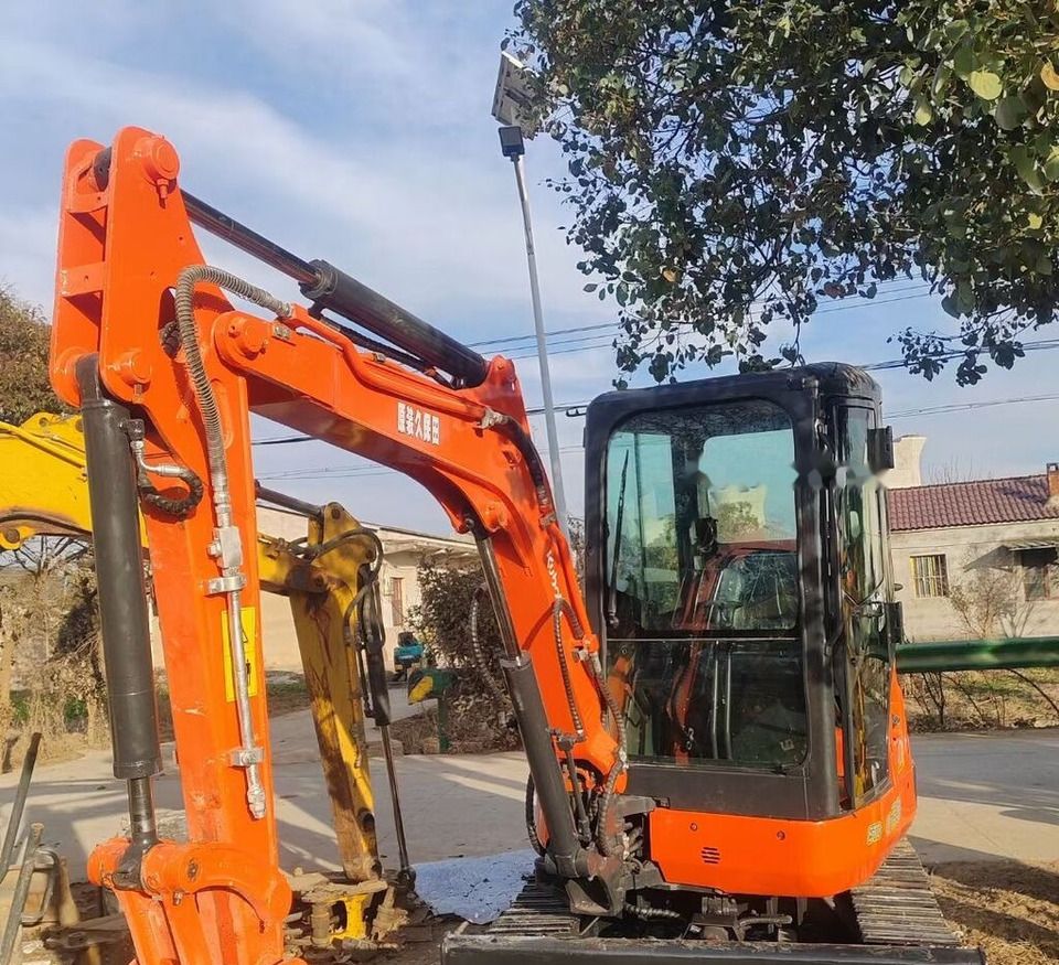 Kubota U-30 mini excavator, side view