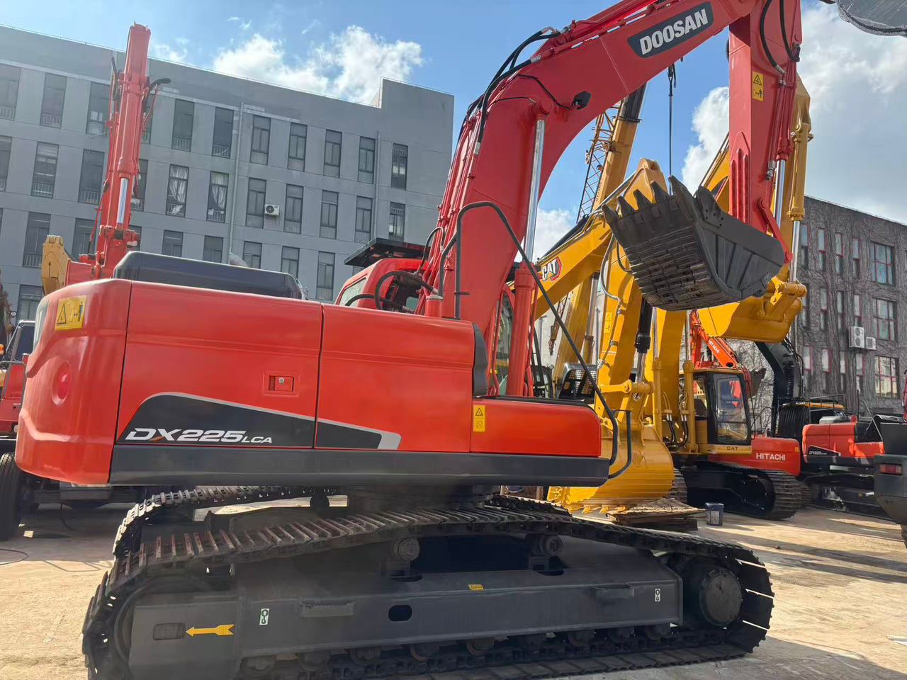 2023 Doosan DX225LCA crawler excavator, rear three-quarter view 2023 Doosan DX225LCA crawler excavator, rear three-quarter view