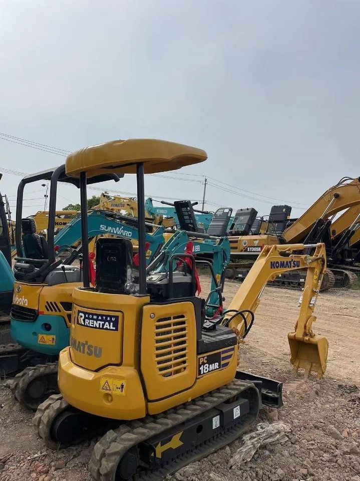 2020 Komatsu PC18MR mini excavator, rear three-quarter view 2020 Komatsu PC18MR mini excavator, rear three-quarter view