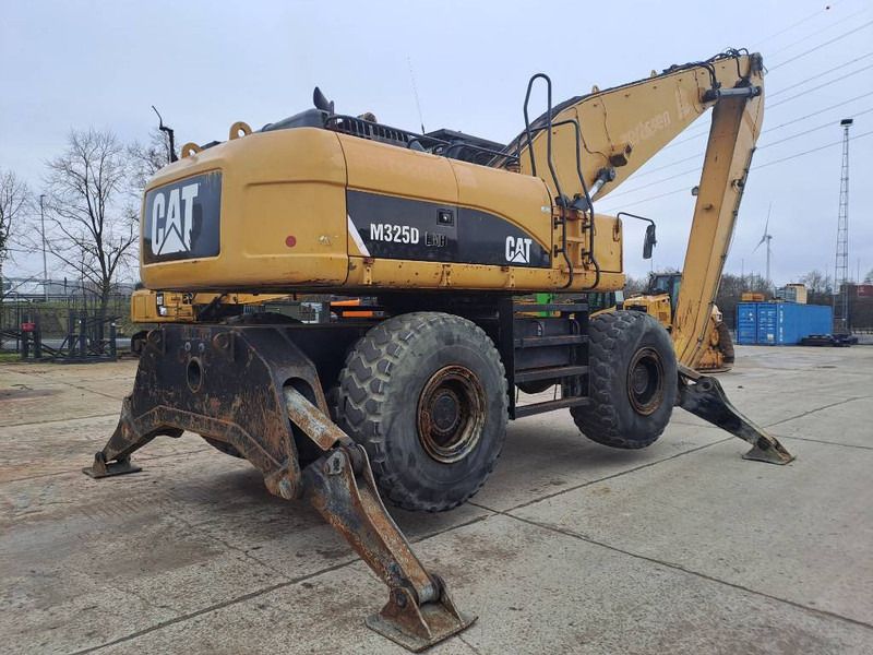 2009 Caterpillar M325D LMH material handler, rear three-quarter view 2009 Caterpillar M325D LMH material handler, rear three-quarter view