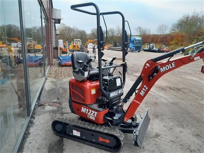 Mole M12 mini excavator, side view Mole M12 mini excavator, side view