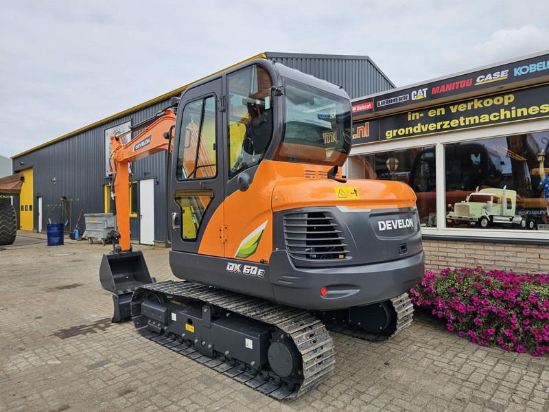 2024 Develon DX60E-10N mini excavator, rear three-quarter view