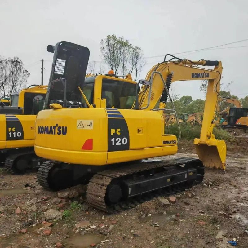 Komatsu PC120-6 crawler excavator, rear three-quarter view Komatsu PC120-6 crawler excavator, rear three-quarter view