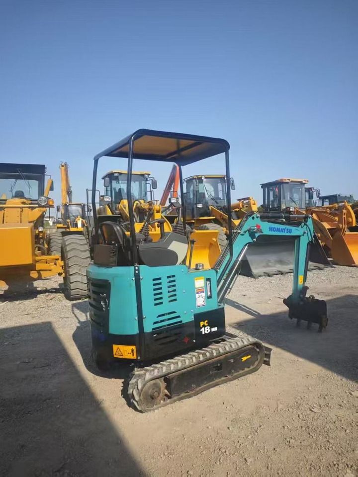 2023 Komatsu PC18 mini excavator, rear three-quarter view 2023 Komatsu PC18 mini excavator, rear three-quarter view