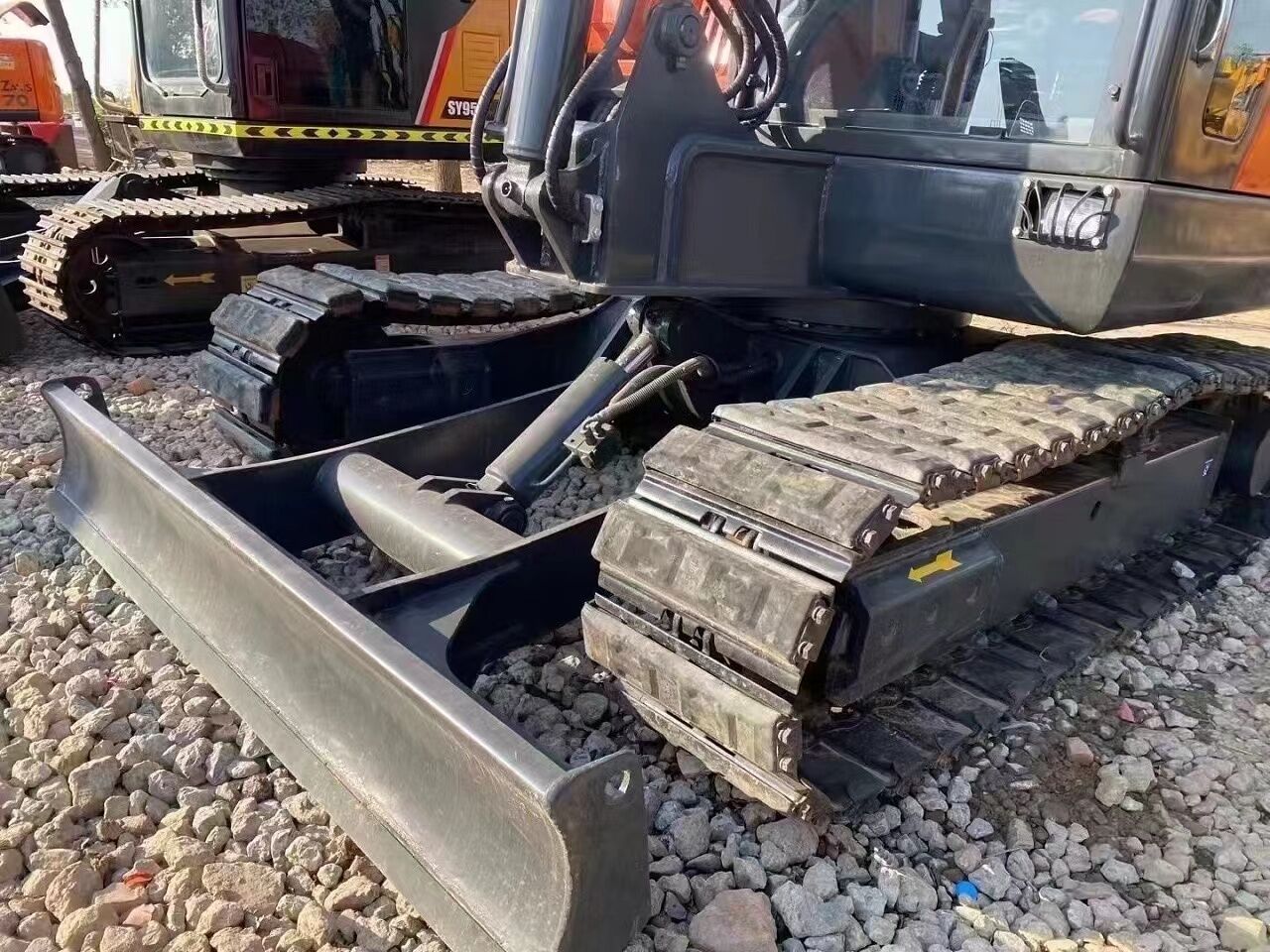 2023 Doosan DX60 mini excavator front view with blade