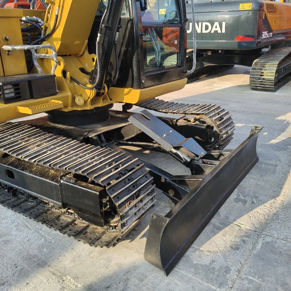 2022 Caterpillar 308E2 mini excavator, lower chassis and blade view 2022 Caterpillar 308E2 mini excavator, lower chassis and blade view
