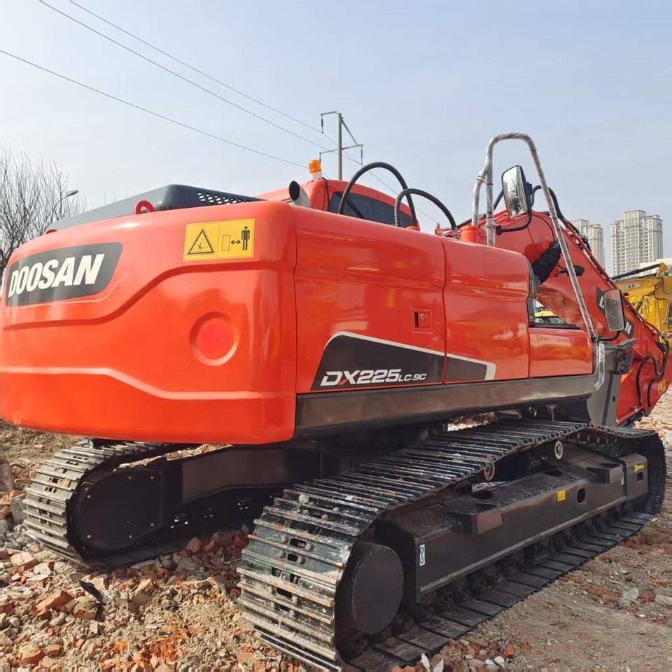 2023 Doosan DX225LC-9C excavator, rear three-quarter view 2023 Doosan DX225LC-9C excavator, rear three-quarter view