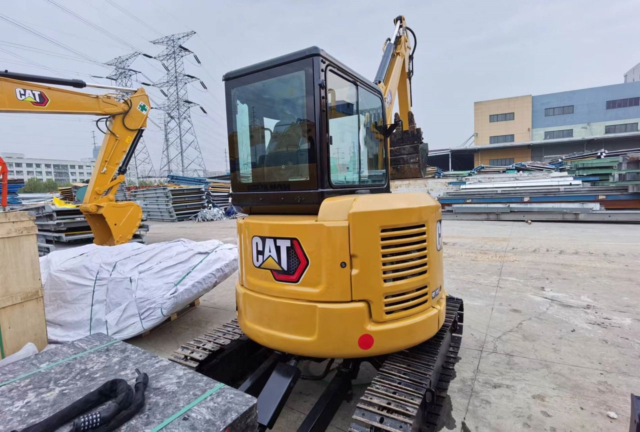 2023 Caterpillar 303.5E mini excavator, rear three-quarter view 2023 Caterpillar 303.5E mini excavator, rear three-quarter view