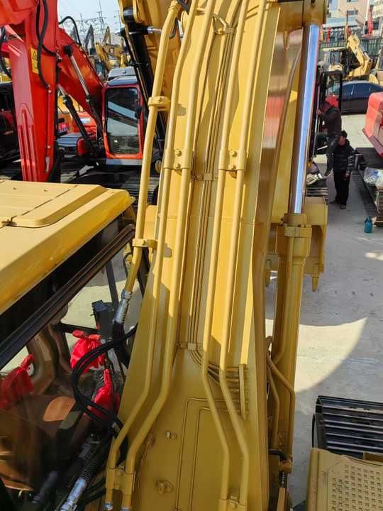 2024 Caterpillar 320BL crawler excavator boom and hydraulic detail