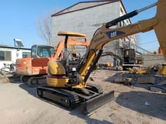 2022 Caterpillar 303CR mini excavator, rear three-quarter view 2022 Caterpillar 303CR mini excavator, rear three-quarter view