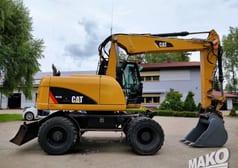 2012 CAT M313D wheel excavator side view