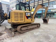 2022 Caterpillar 307E crawler excavator, rear three-quarter view 2022 Caterpillar 307E crawler excavator, rear three-quarter view