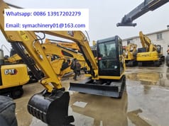 2023 Caterpillar 306E2 mini excavator front three-quarter view 2023 Caterpillar 306E2 mini excavator front three-quarter view
