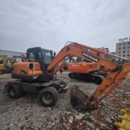 2018 Doosan DX60W wheel excavator, side view