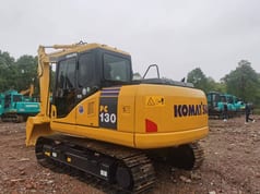 Komatsu PC130 crawler excavator, rear three-quarter view