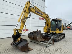 2022 Komatsu PC138US-11 crawler excavator, front three-quarter view 2022 Komatsu PC138US-11 crawler excavator, front three-quarter view