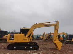 Komatsu PC130 crawler excavator, side profile view Komatsu PC130 crawler excavator, side profile view
