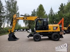 2012 Caterpillar M313D wheel excavator, side profile view 2012 Caterpillar M313D wheel excavator, side profile view