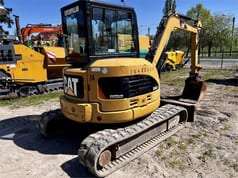 2007 Caterpillar 304CCR mini excavator, rear three-quarter view