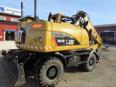 Caterpillar M316D wheel excavator rear three-quarter view