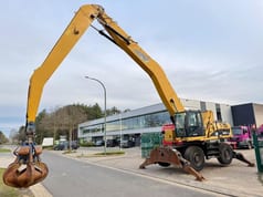 2011 Caterpillar 325D material handler, side view with grapple