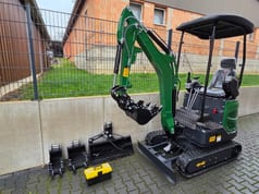 Mini excavator with bucket package, side view Mini excavator with bucket package, side view