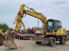 2007 Komatsu PW140-7 wheel excavator, front three-quarter view 2007 Komatsu PW140-7 wheel excavator, front three-quarter view