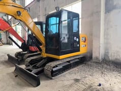 Caterpillar 307E2 mini excavator, side view Caterpillar 307E2 mini excavator, side view
