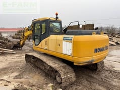 2006 Komatsu PC210LC-7 crawler excavator, rear three-quarter view 2006 Komatsu PC210LC-7 crawler excavator, rear three-quarter view