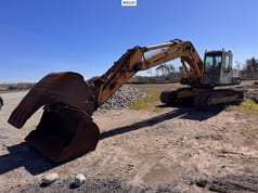 1994 Komatsu PC210-5 excavator side view