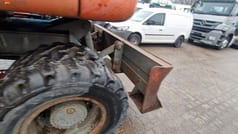 1990 Atlas 1604K wheel excavator rear view with dozer blade