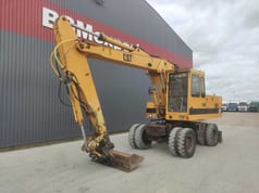 1992 Caterpillar 214B wheel excavator, side profile view