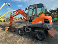 2015 Doosan DX55W mini excavator, side view