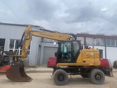 2022 Caterpillar M319-07B wheel excavator side view