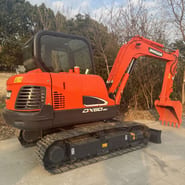 2023 Doosan DX60-9C mini excavator, rear three-quarter view 2023 Doosan DX60-9C mini excavator, rear three-quarter view