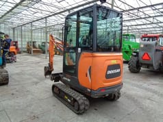 2017 Doosan DX19 mini excavator, rear three-quarter view 2017 Doosan DX19 mini excavator, rear three-quarter view