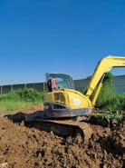 2022 Yanmar VIO75 mini excavator, rear three-quarter view 2022 Yanmar VIO75 mini excavator, rear three-quarter view
