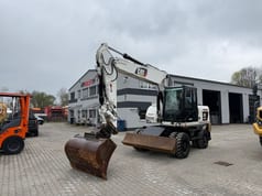 2010 Caterpillar M316D wheel excavator, front three-quarter view