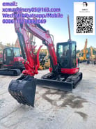 2023 Kubota KX057-4 mini excavator, front three-quarter view