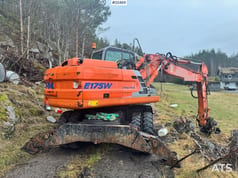 2003 Kobelco E175W Evolution wheel excavator, rear three-quarter view 2003 Kobelco E175W Evolution wheel excavator, rear three-quarter view