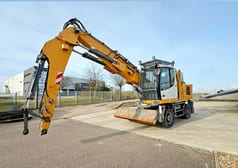 2015 Liebherr LH22 M material handler, front three-quarter view