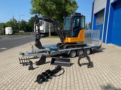 Berger Kraus BK2800ASR mini excavator on trailer with attachments