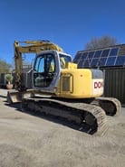 2006 New Holland E135SR-1E crawler excavator, rear three-quarter view
