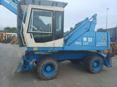2003 Fuchs MHL320 wheel excavator, side view