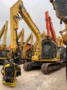 2021 Komatsu PC120 crawler excavator with tree shear attachment, front three-quarter view