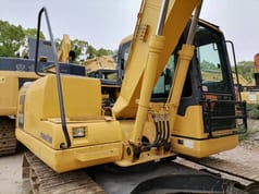 2023 Komatsu PC110-7 excavator, rear three-quarter view