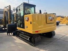 2026 Caterpillar 307 mini excavator, rear three-quarter view