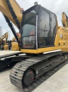 2023 Caterpillar 320 excavator, side view of cab and tracks