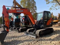 2023 Doosan DX60 mini excavator, side view 2023 Doosan DX60 mini excavator, side view